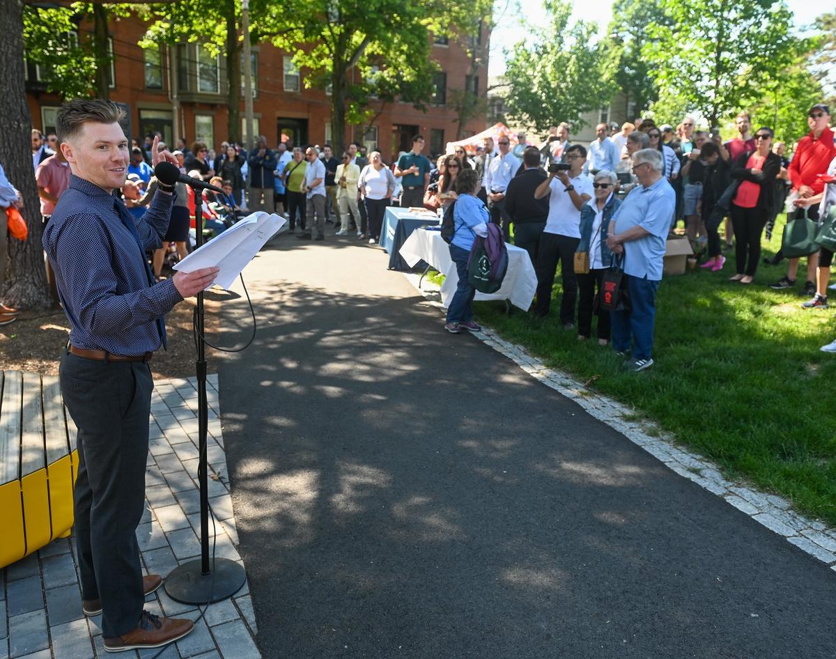 Charlestown liaison gives a speech in a local park