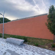 Orange Wall adjacent to plaza at Grove Hall municipal parking lot