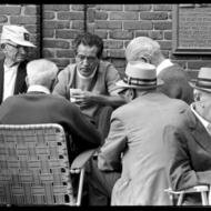 Close-up of men playing cards on Paul Revere Mall, North End, Boston, ca. August 1972